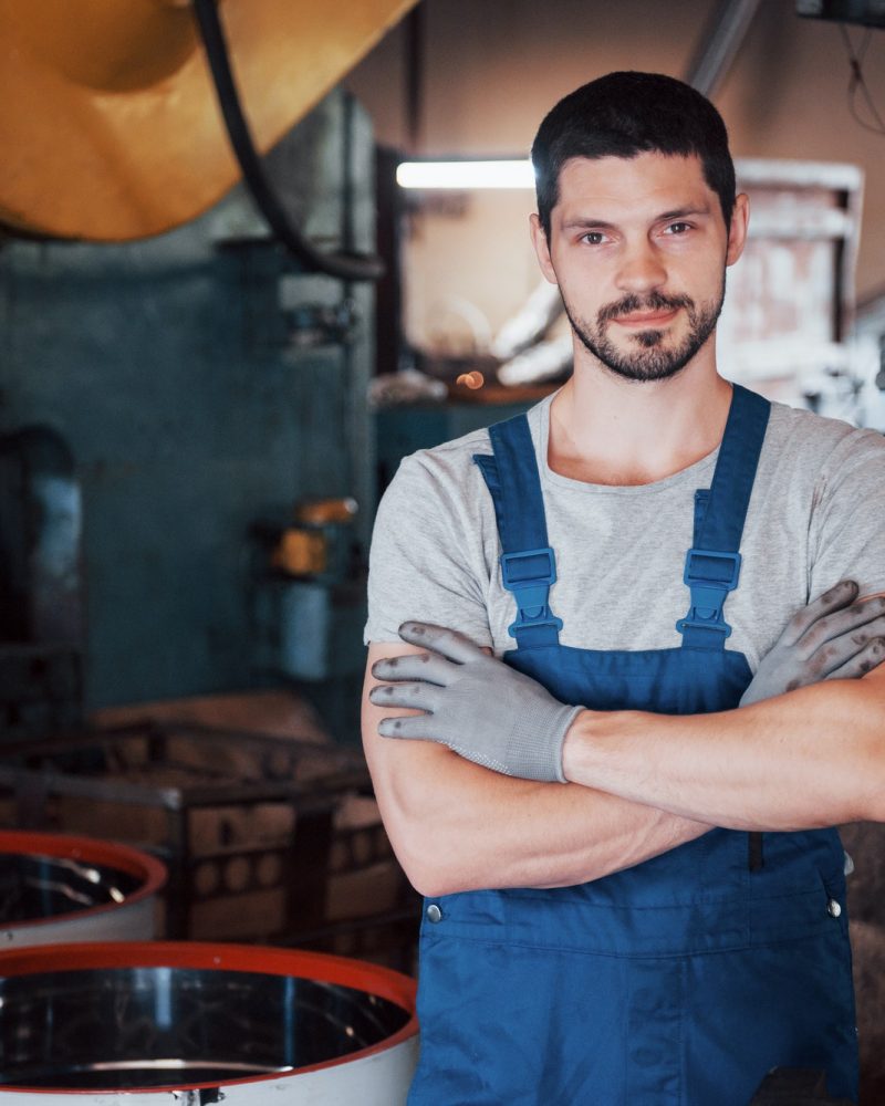 portrait-of-a-young-worker-in-a-hard-hat-at-a-large-waste-recycling-factory-the-engineer-monitors-1.jpg